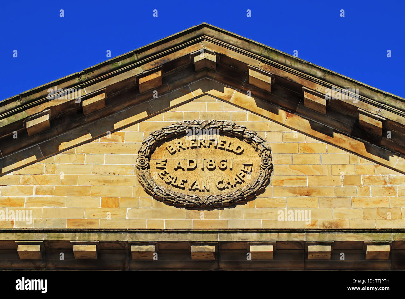The roof line and symbol on the Wesleyan Chapel in Brierfield, Lancashire Stock Photo