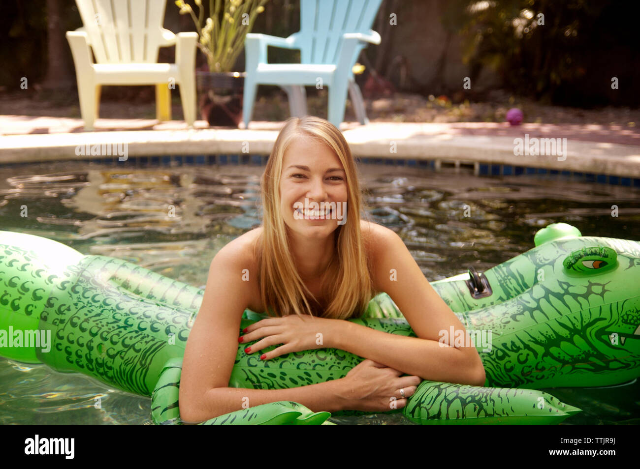 Woman in the pool hi-res stock photography and images - Alamy