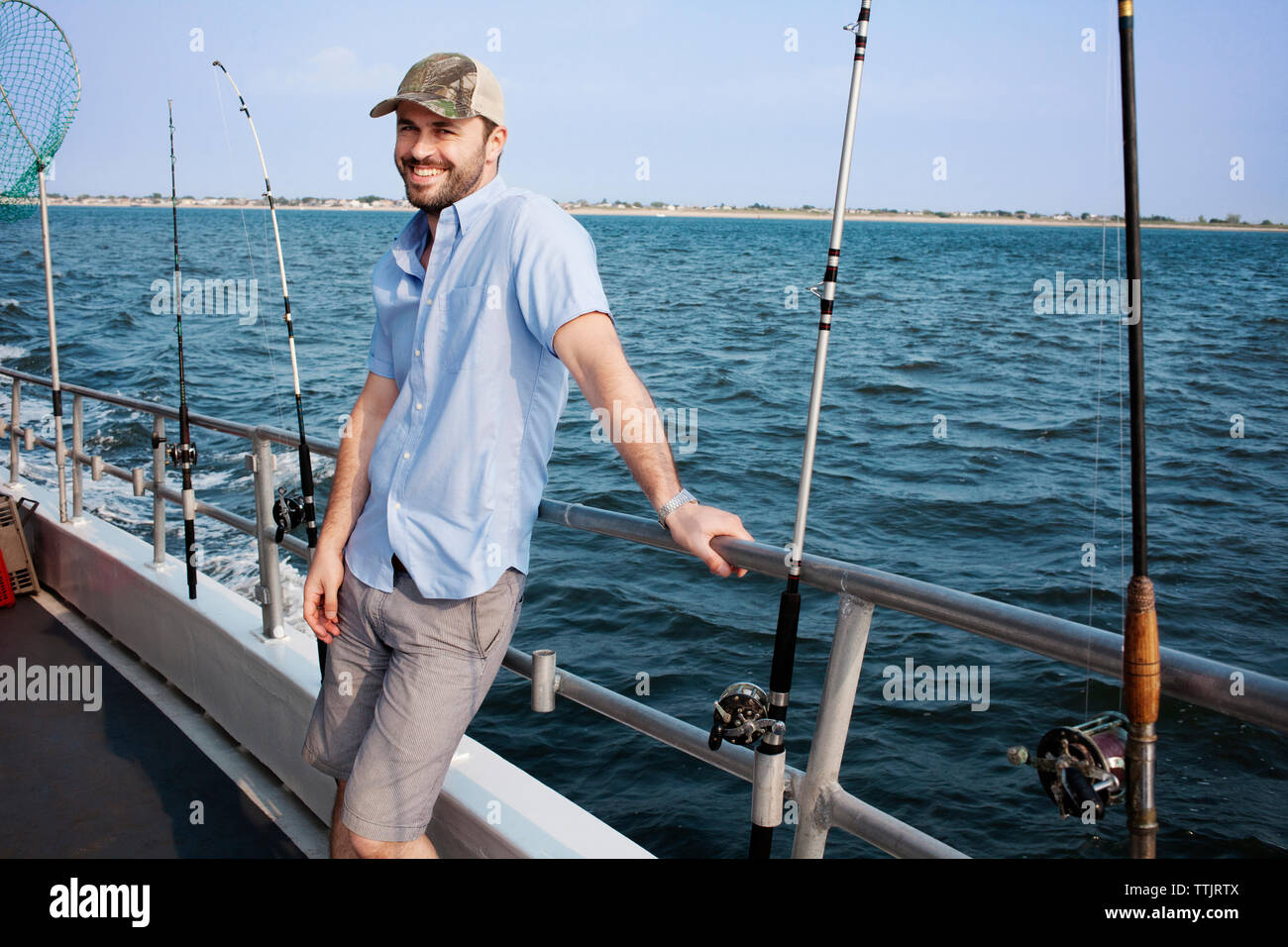 Vintage bamboo fishing rods and conventional reels Stock Photo - Alamy