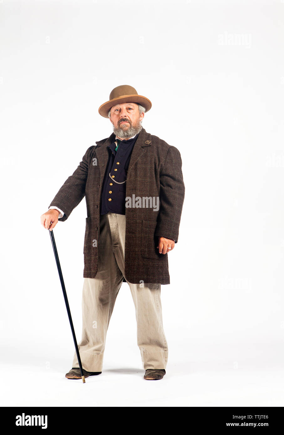 Portrait of serious man in retro styled costume against white background Stock Photo