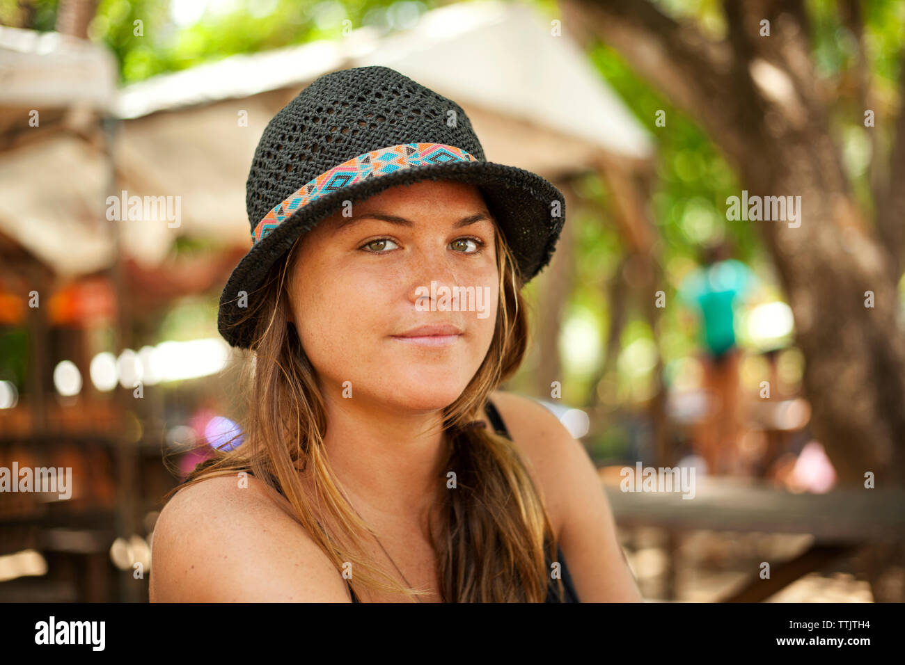 Portrait of woman in hat enjoying at resort Stock Photo