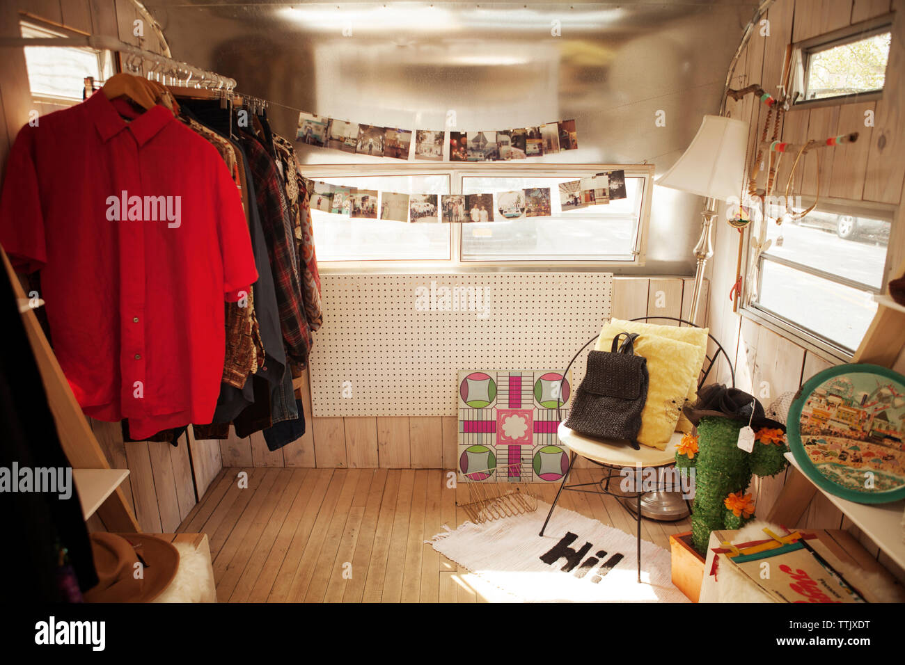 Clothes Rack and photographs in camper van Stock Photo