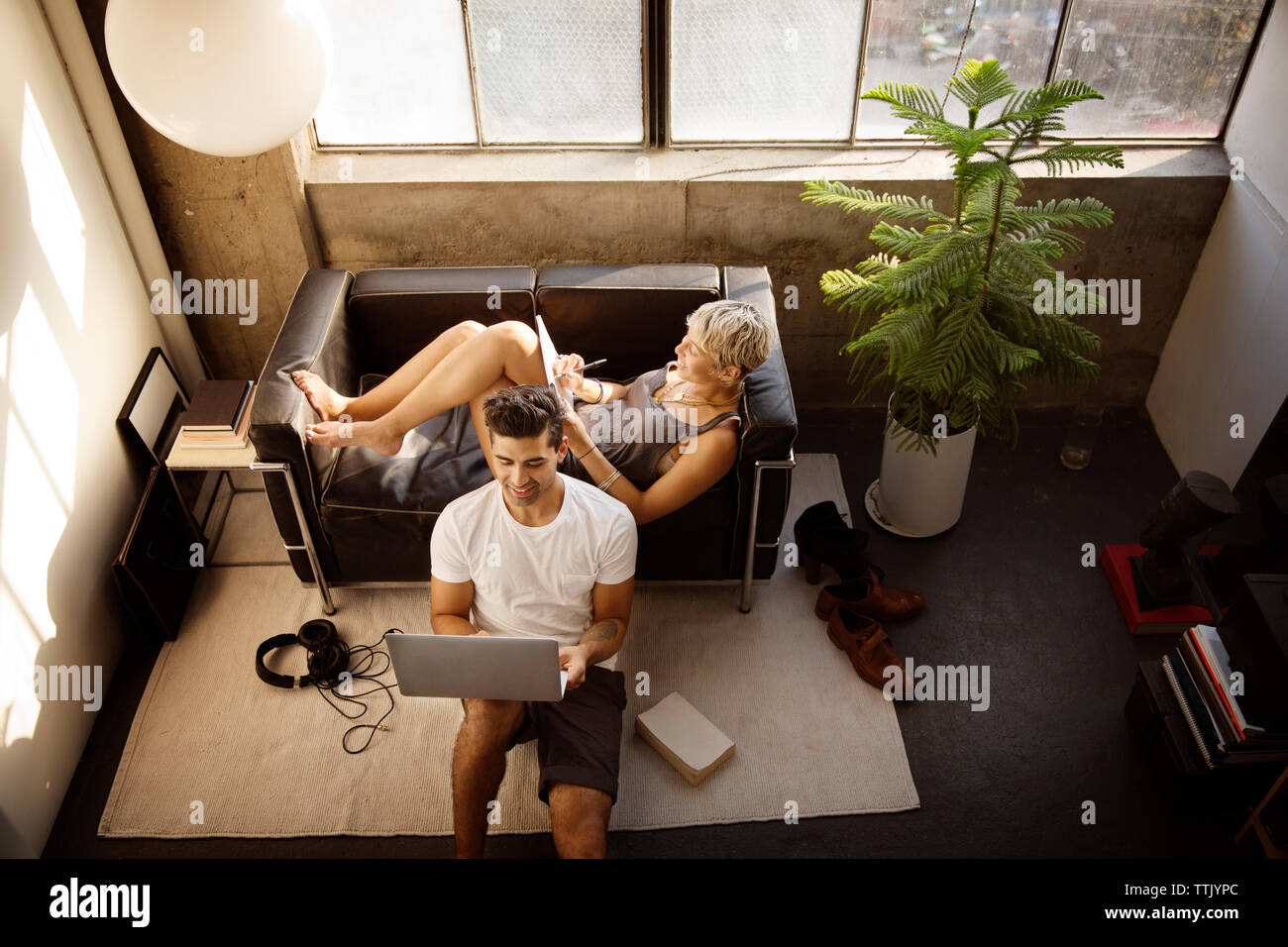 High angle view of couple resting in living room at home Stock Photo