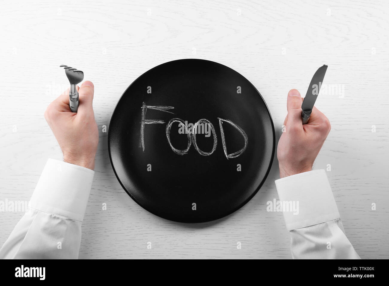 Man Holding Knife And Fork High Resolution Stock Photography and Images