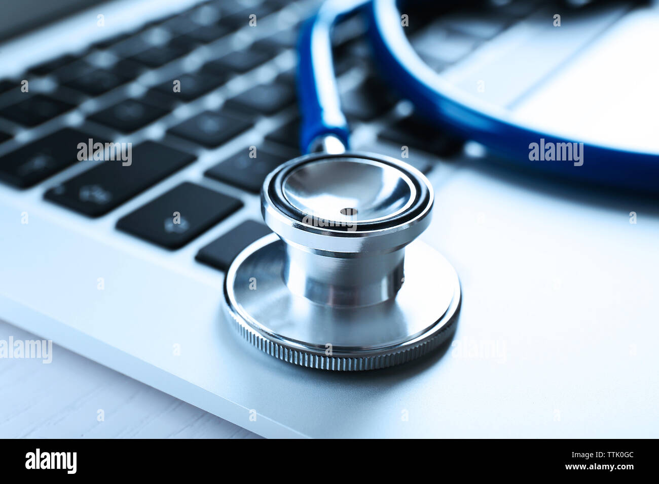 Stethoscope on laptop, close-up Stock Photo - Alamy