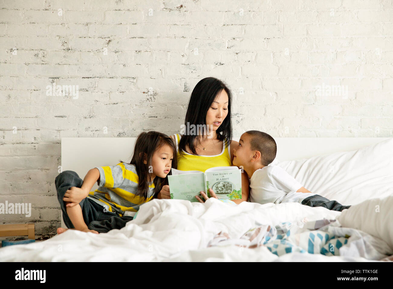 Indian girl reading book bed hi-res stock photography and images - Alamy