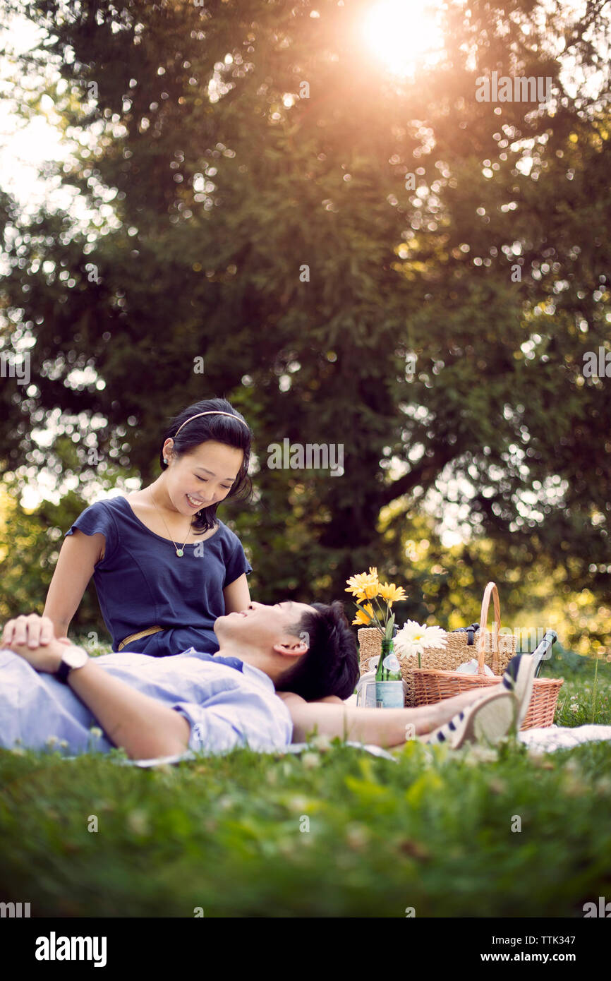 Young couple sitting relaxing on grass hi-res stock photography and ...
