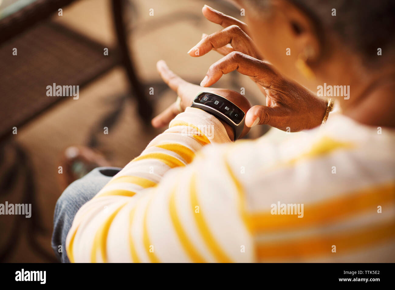 Close-up of senior woman using smart watch Stock Photo