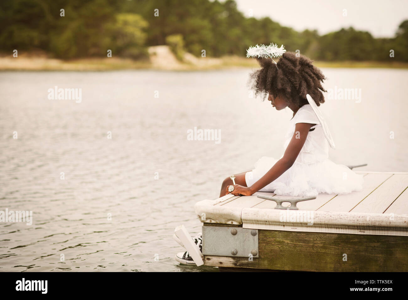 Side view african girl sitting hi-res stock photography and images - Alamy
