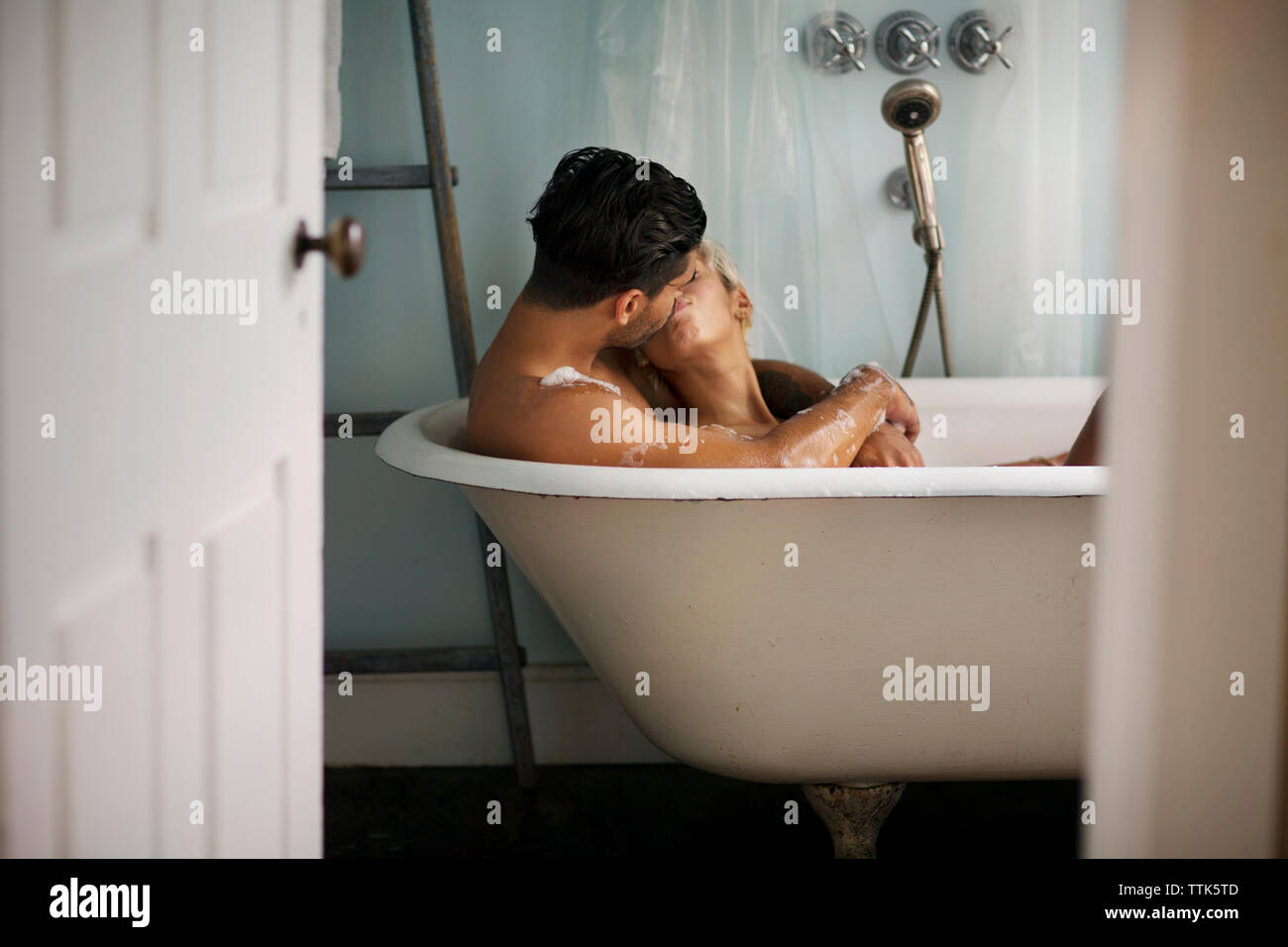 Couple kissing in bathroom hi-res stock photography and images - Alamy