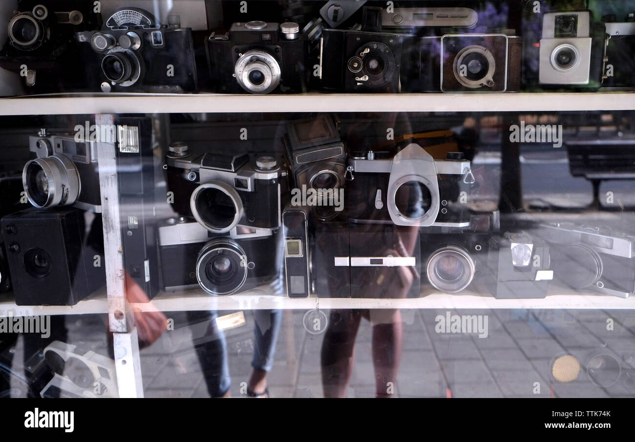 Old cameras on storefront Stock Photo - Alamy