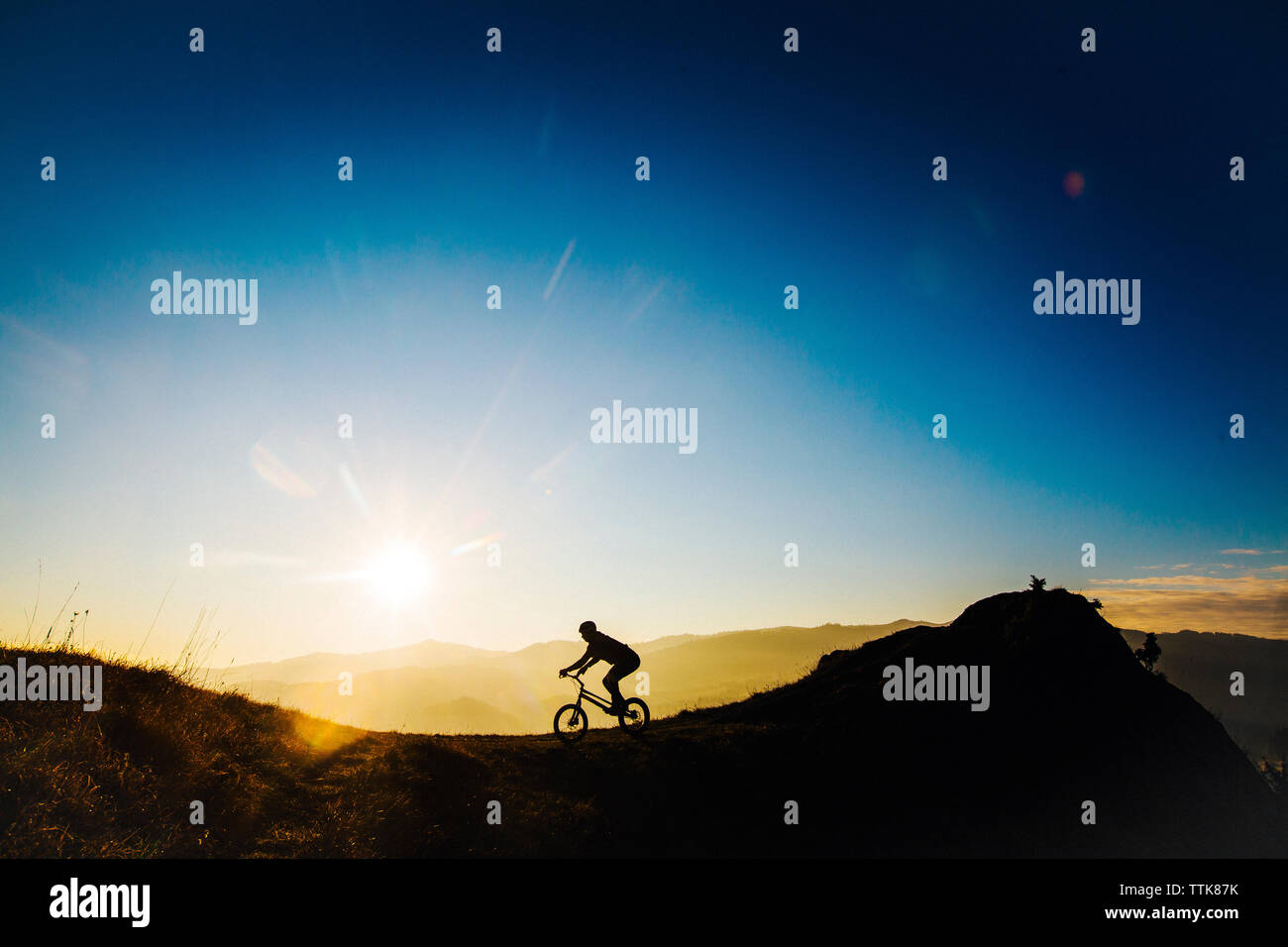 young men is riding on bmx on Slovakia during a sunrise Stock Photo