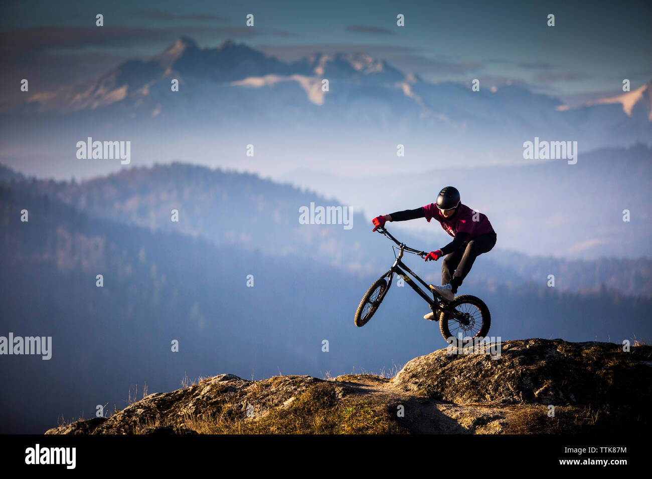 young men is riding on his bike on the rock, Slovakia Stock Photo
