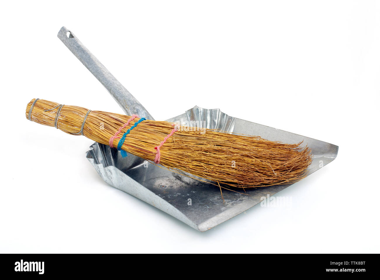 natural broom in metal dustpan on white background Stock Photo - Alamy