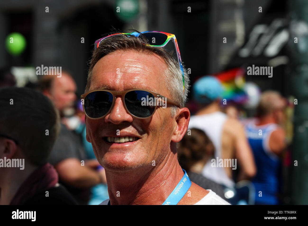 Man wearing two sunglasses at Helsinki Pride parade 2016 in Helsinki, Finland Stock Photo