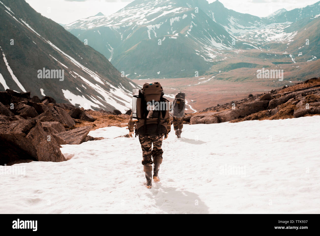 Two tourists backpacks mountain hi-res stock photography and images - Alamy