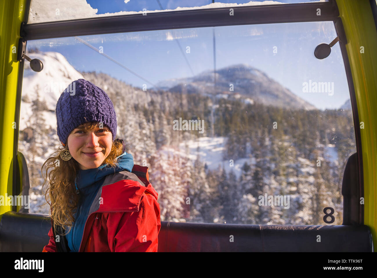 Woman looking at camera from Sea to Sky gondola in Squamish Stock Photo
