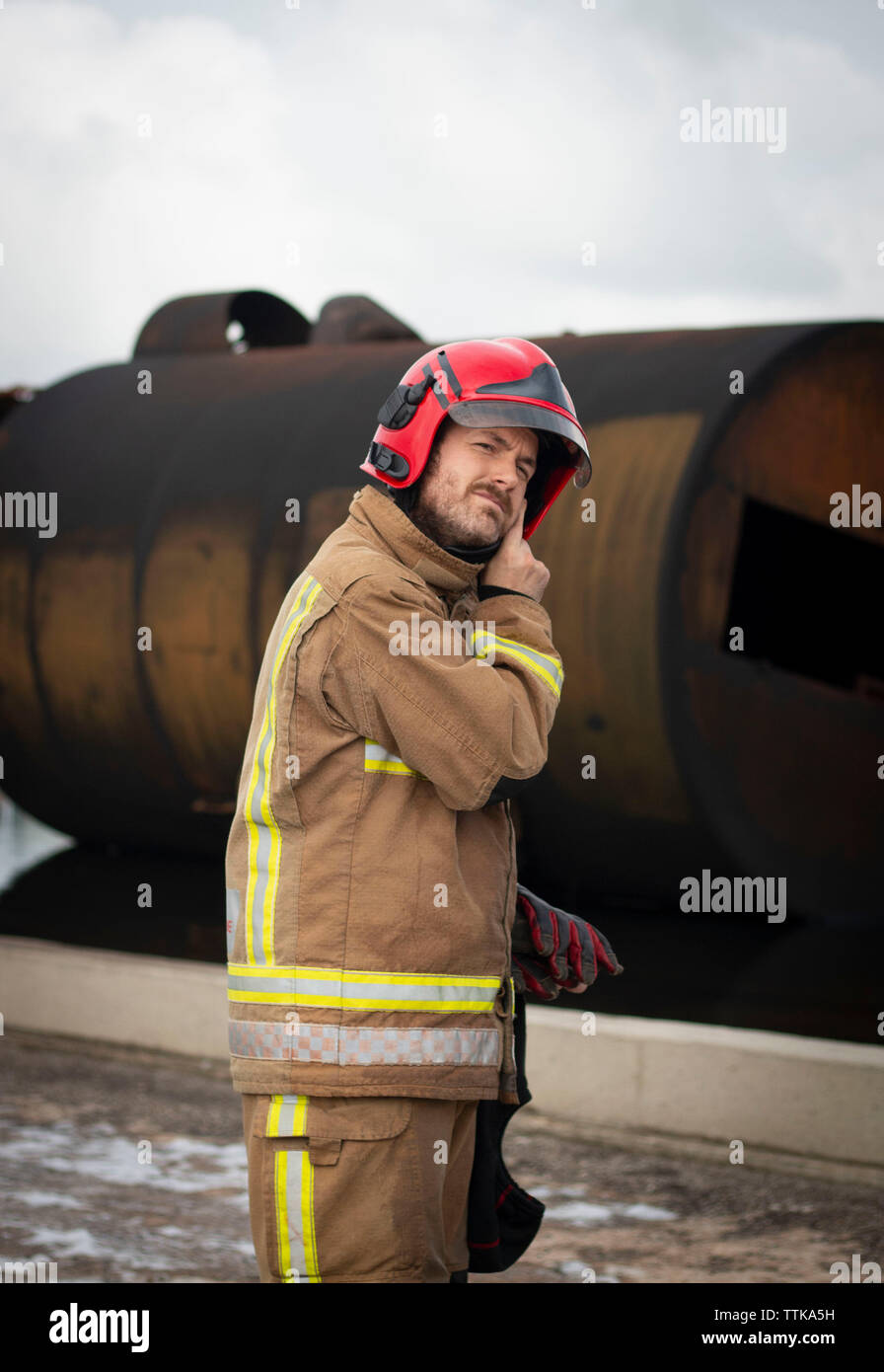 Fireman suiting up to work for the day Stock Photo