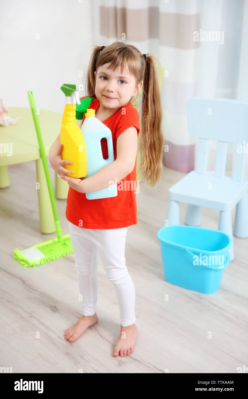 Cute little girl cleaning her room Stock Photo Alamy