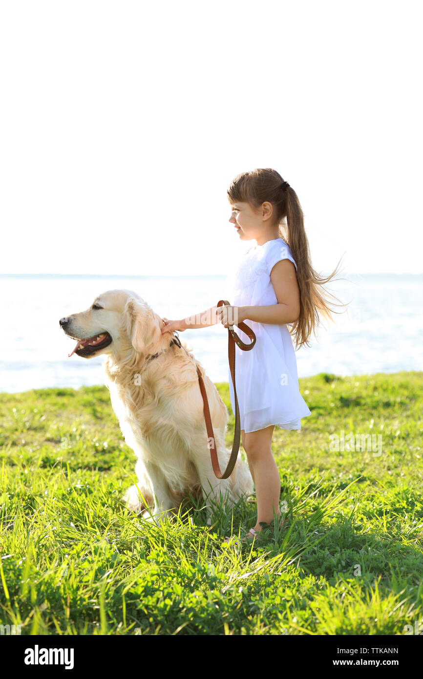 little-girl-and-big-kind-dog-on-the-riverside-stock-photo-alamy