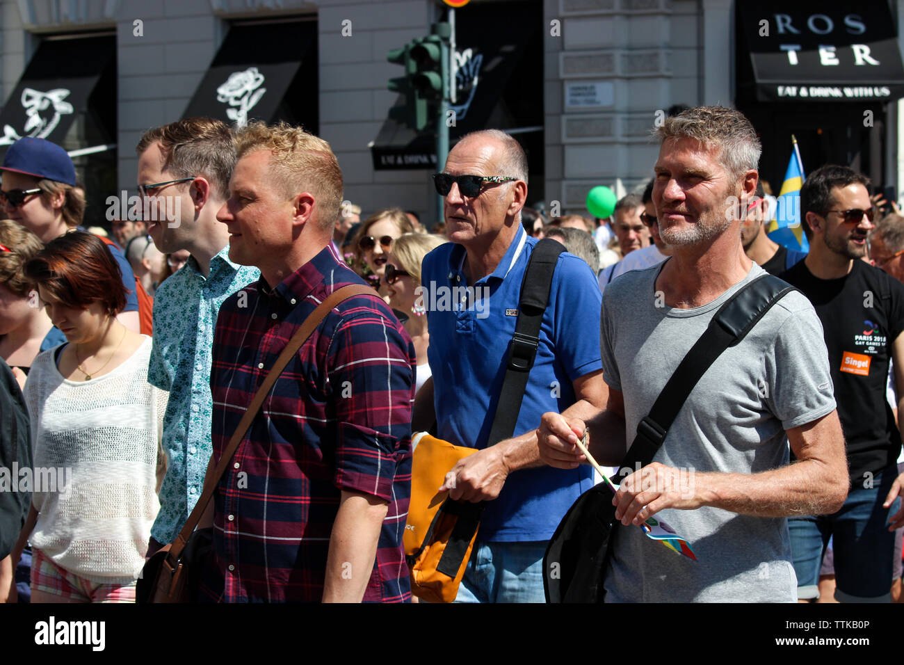 Men marching at Helsinki Pride Parade 2016 in Helsinki, Finland Stock Photo