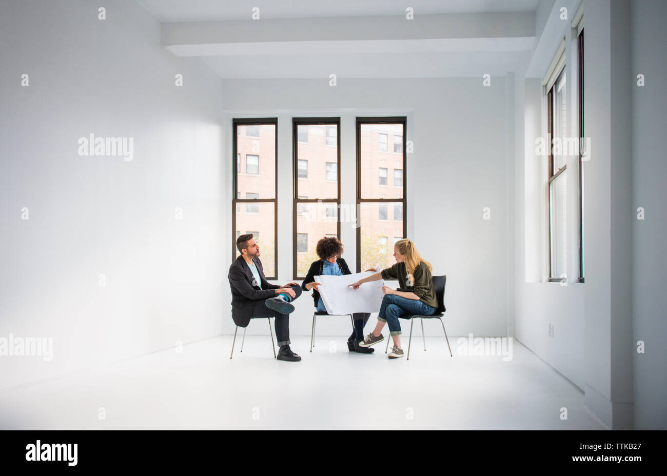 business people discussing about blue print in creative office Stock Photo