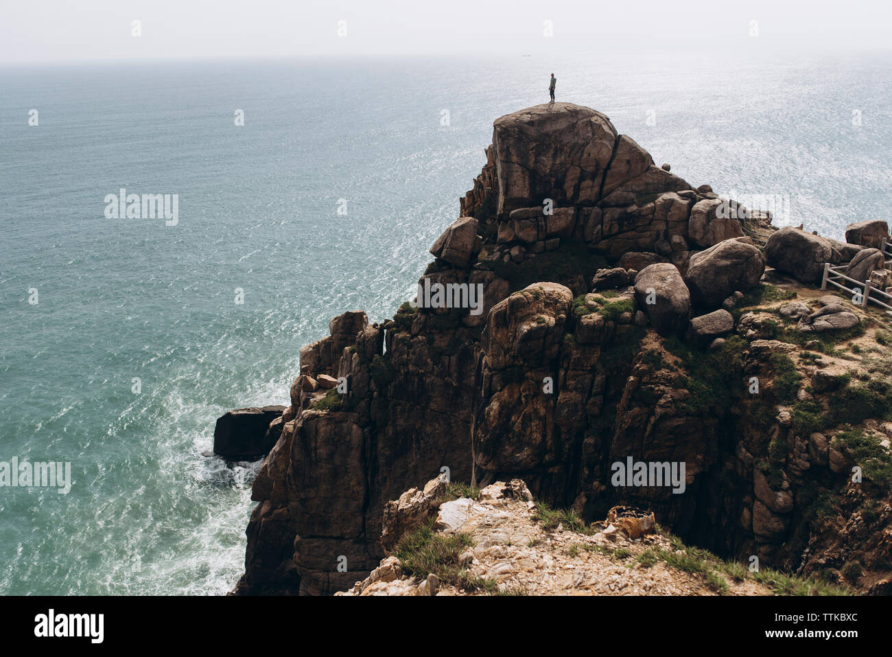 Hiker standing at cliff hi-res stock photography and images - Alamy