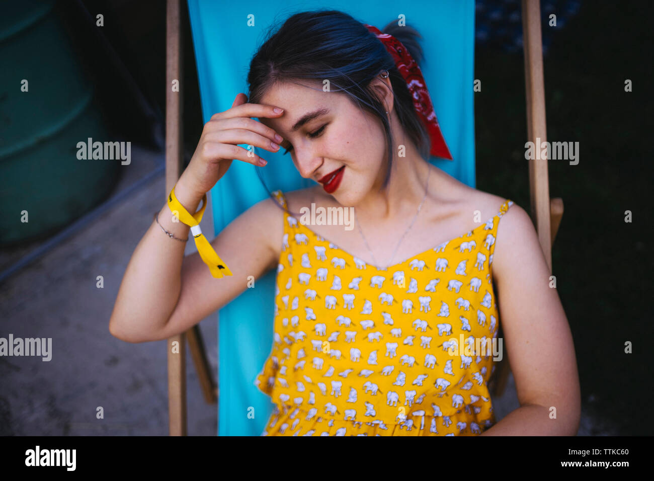 Black woman sitting on chair hi-res stock photography and images - Alamy