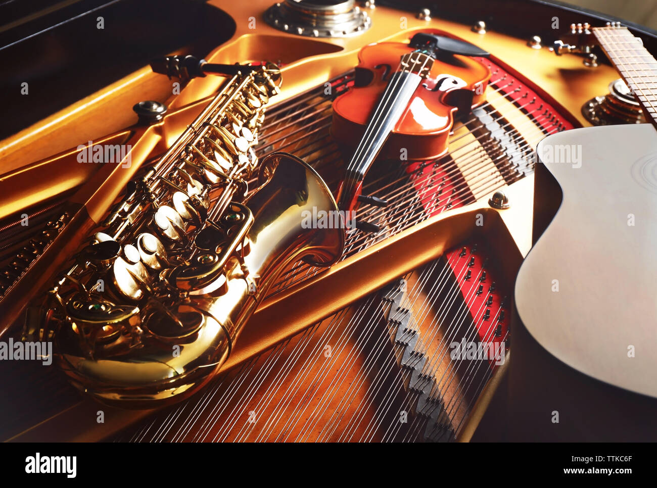 Musical instruments lying on piano, close up Stock Photo