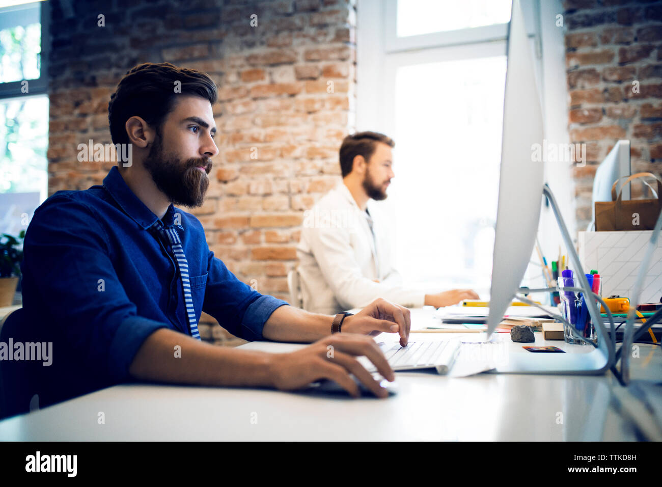 Working desktop computer using keyboard hi-res stock photography and ...