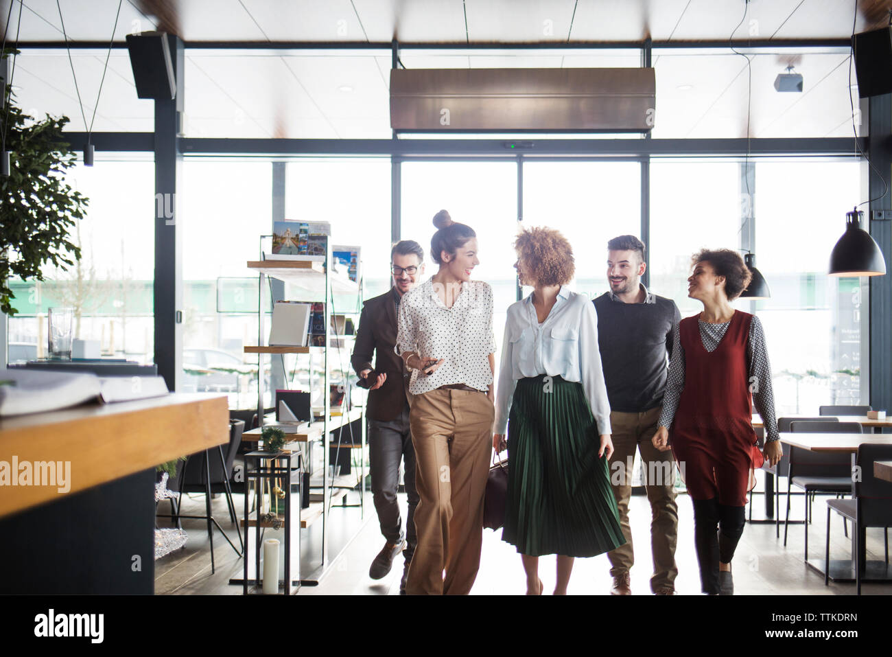 Happy Business People Entering Restaurant Stock Photo Alamy