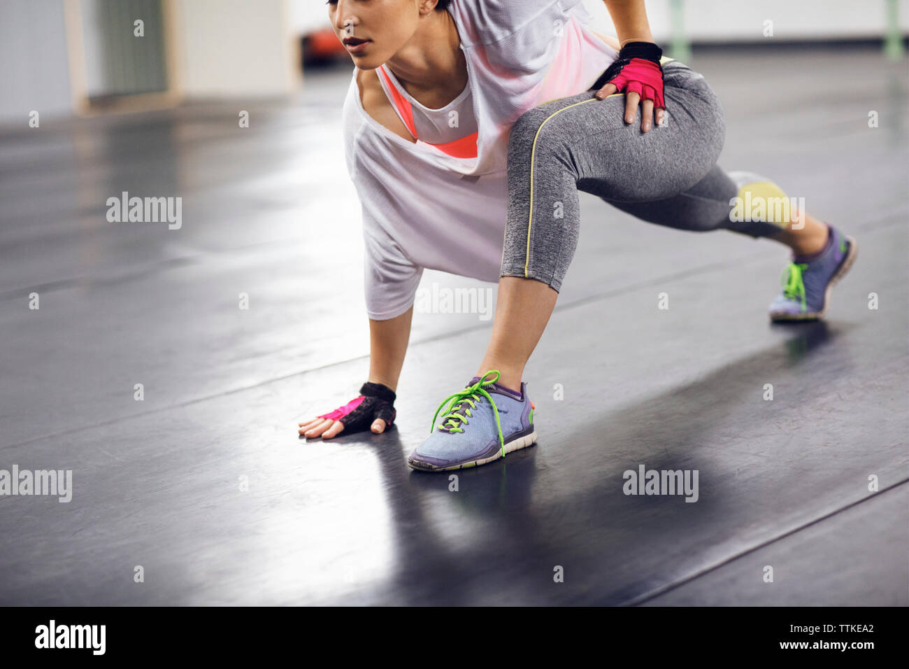 Low section of female athlete exercising in health club Stock Photo