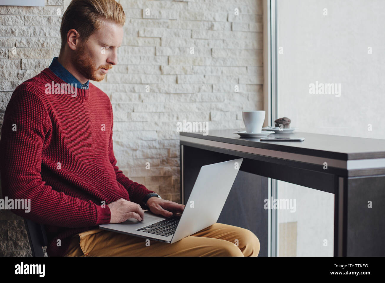 businessman using laptop in restaurant Stock Photo