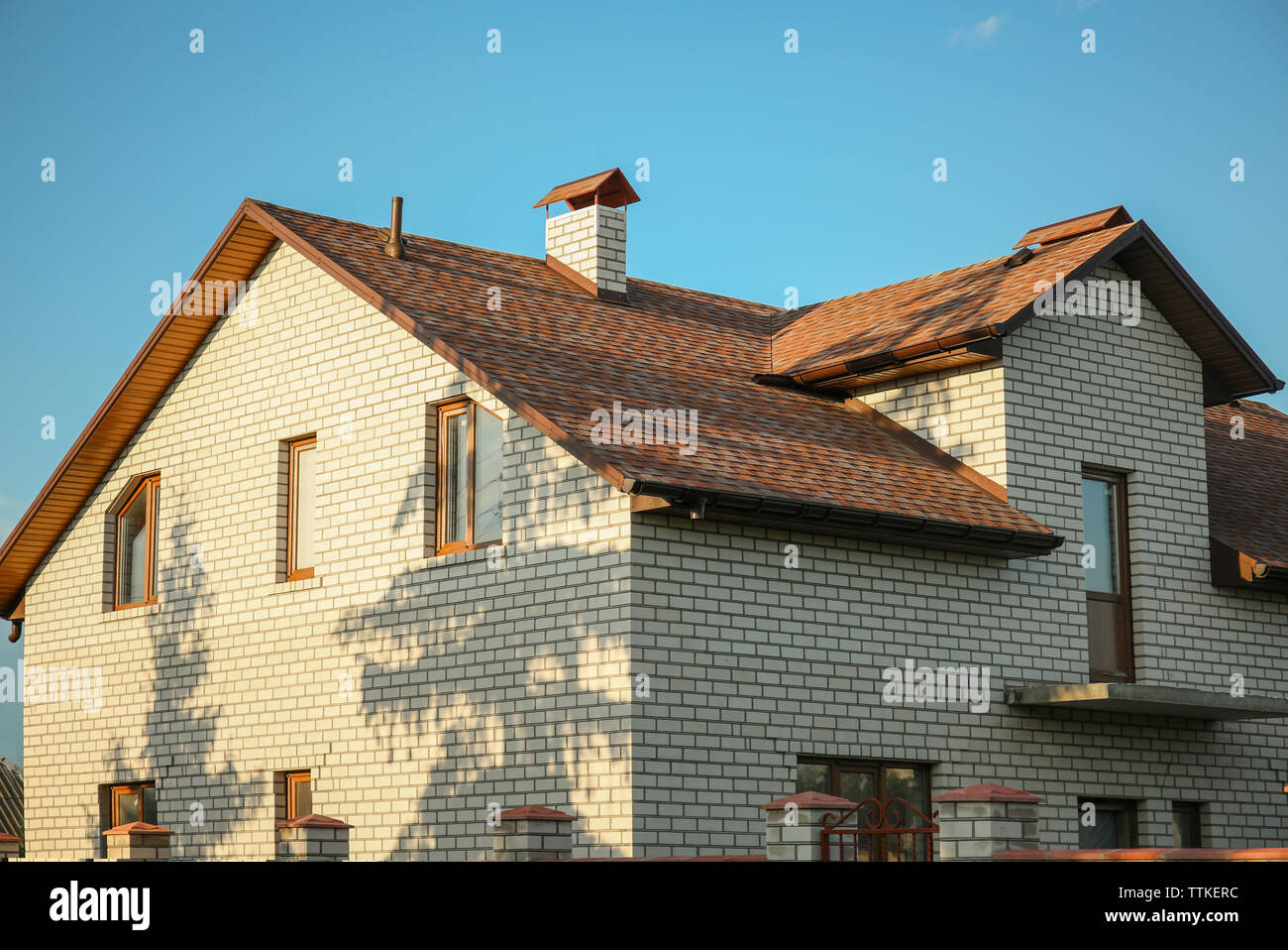 New house on blue sky background Stock Photo - Alamy