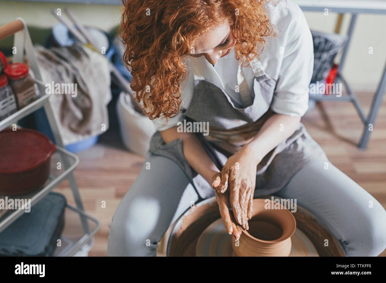 Female potter making pot with clay in Stock Photo Alamy