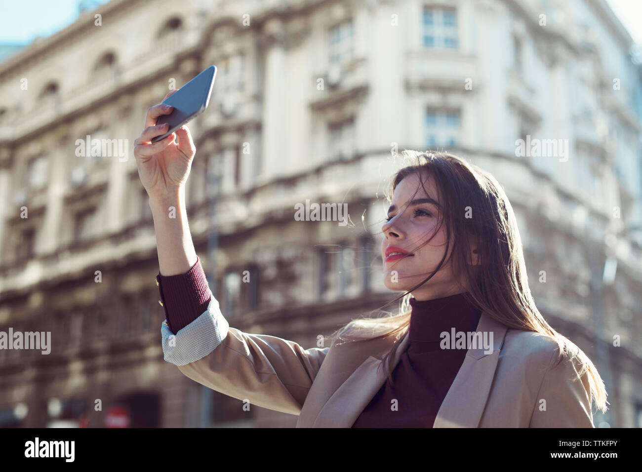 Woman taking selfie on street hi-res stock photography and images - Alamy
