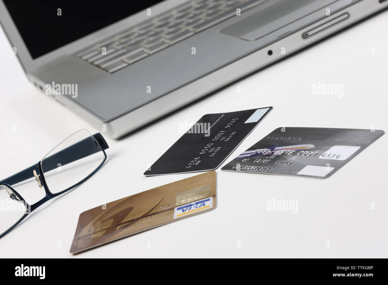 Eyeglasses and credit cards with a laptop Stock Photo Alamy