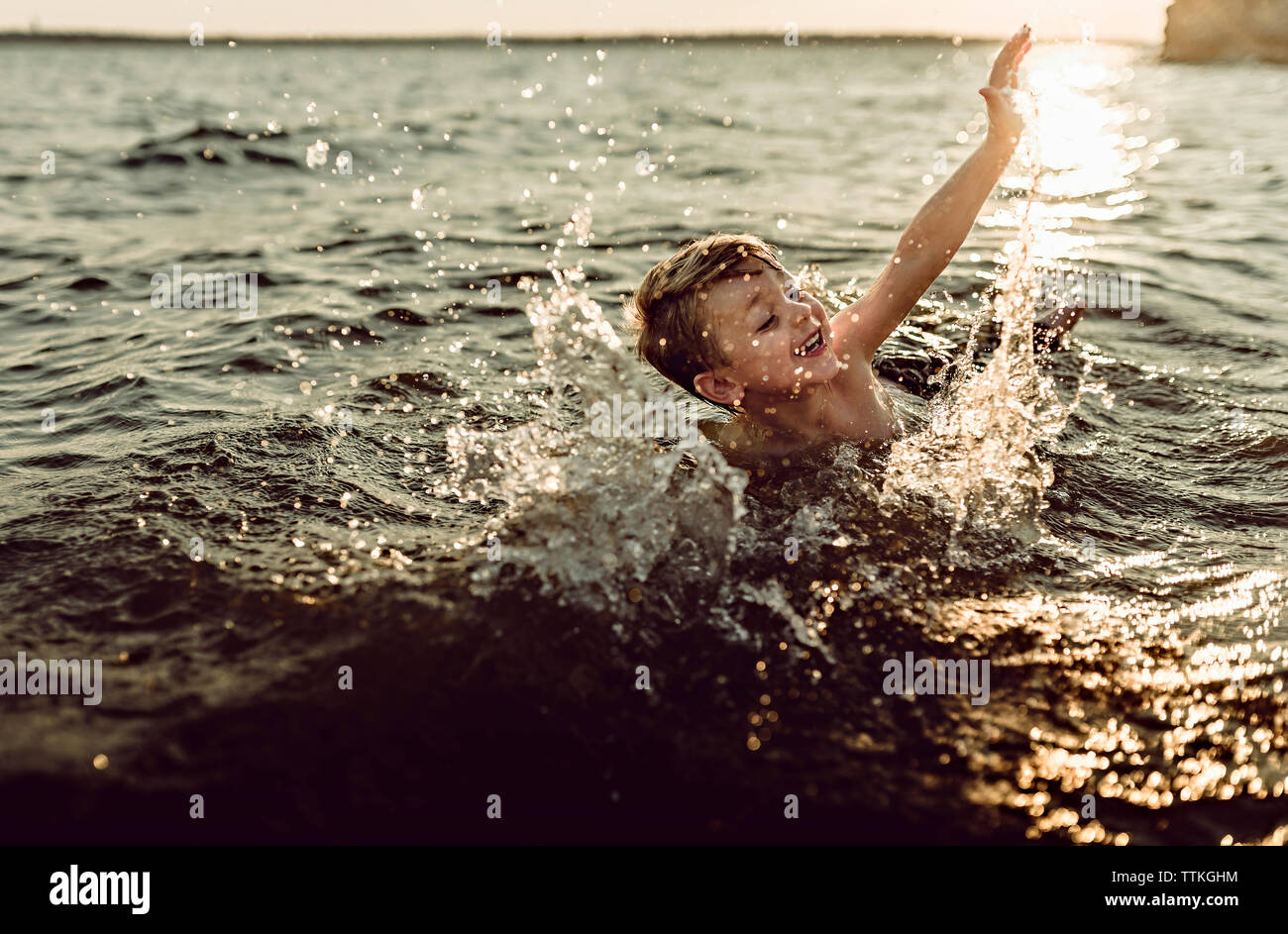 Boy swimming in river hires stock photography and images Alamy
