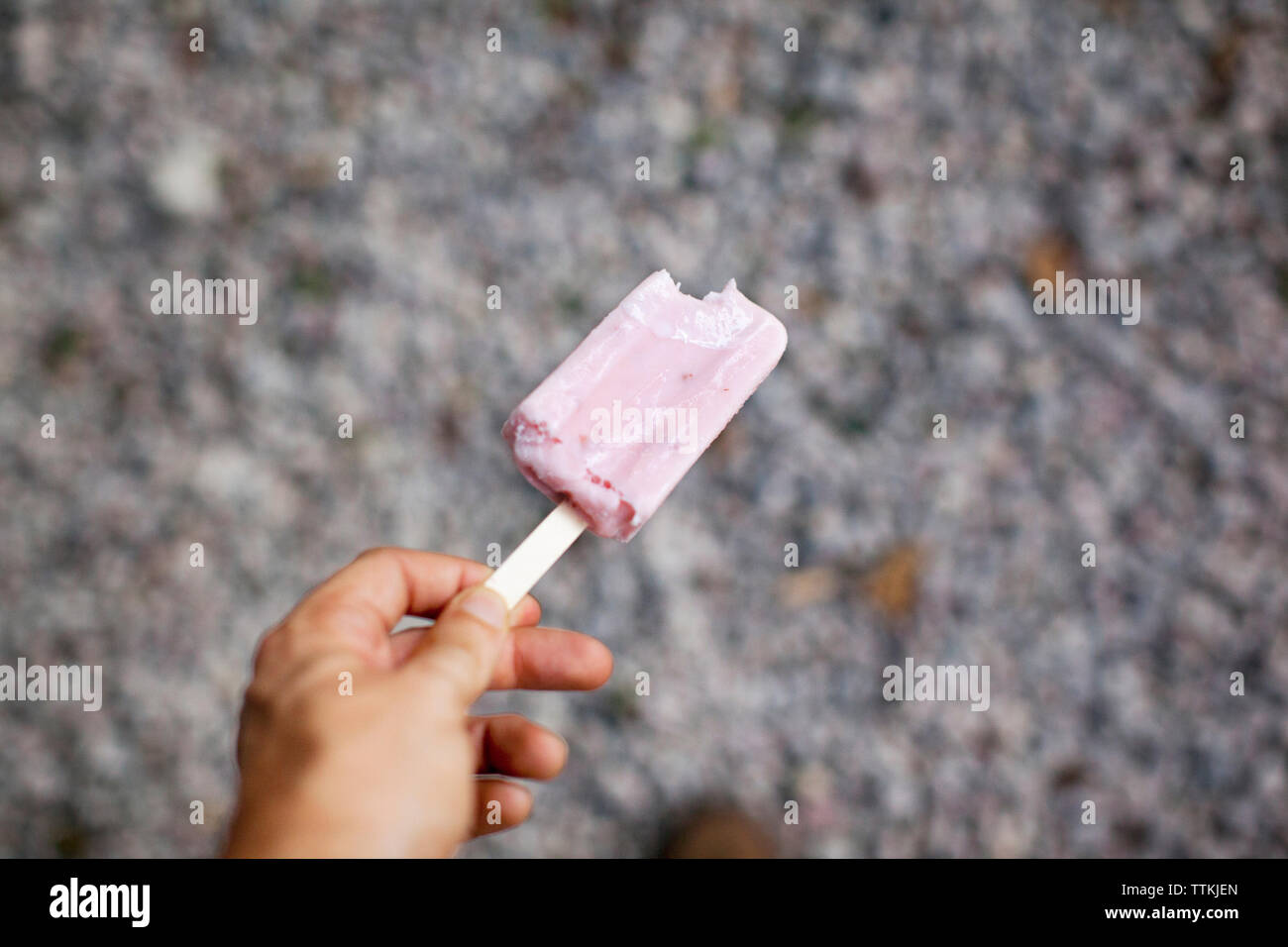 Overhead view of woman holding popsicle Stock Photo