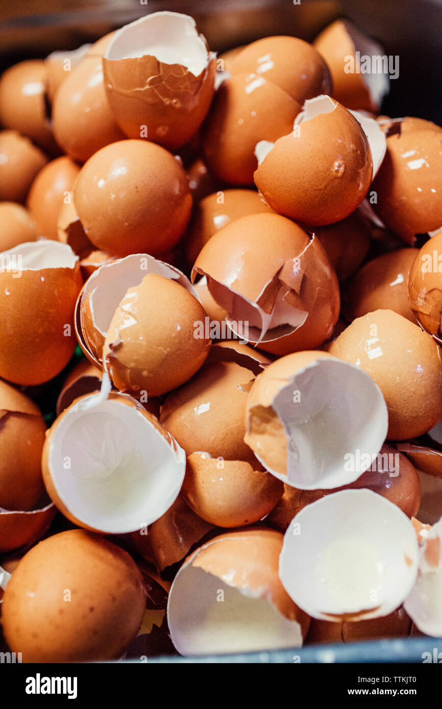 High angle view of broken eggshells in commercial kitchen Stock Photo