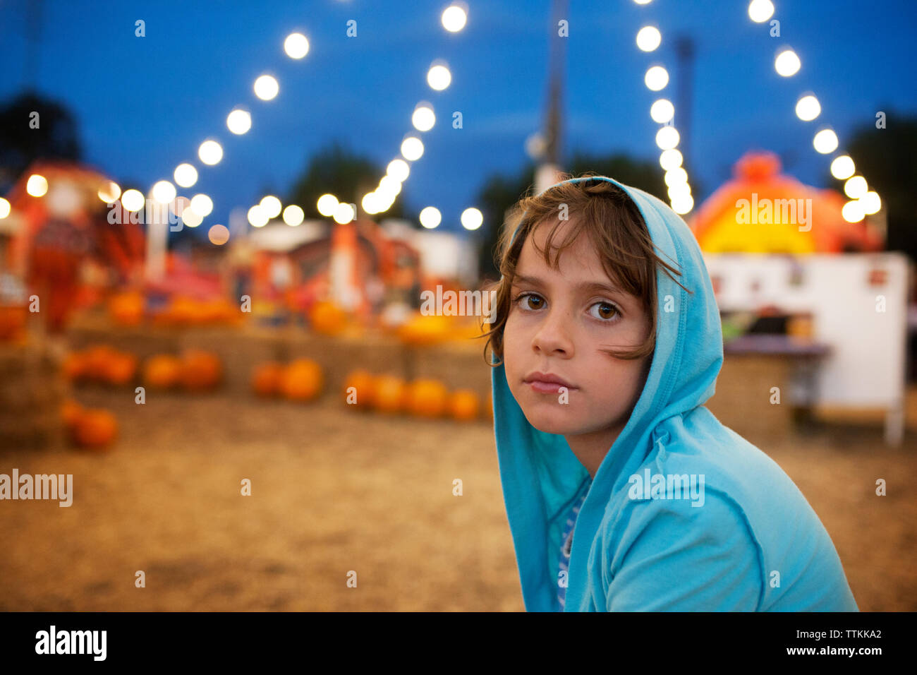 Portrait of cute girl wearing hooded jacket during Halloween Stock Photo