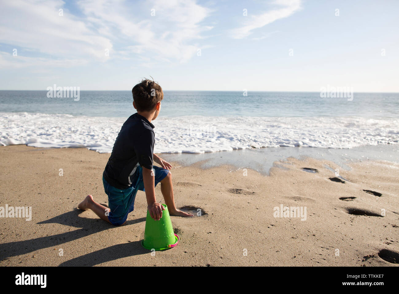 Teenage boy sitting beach looking hi-res stock photography and images -  Alamy
