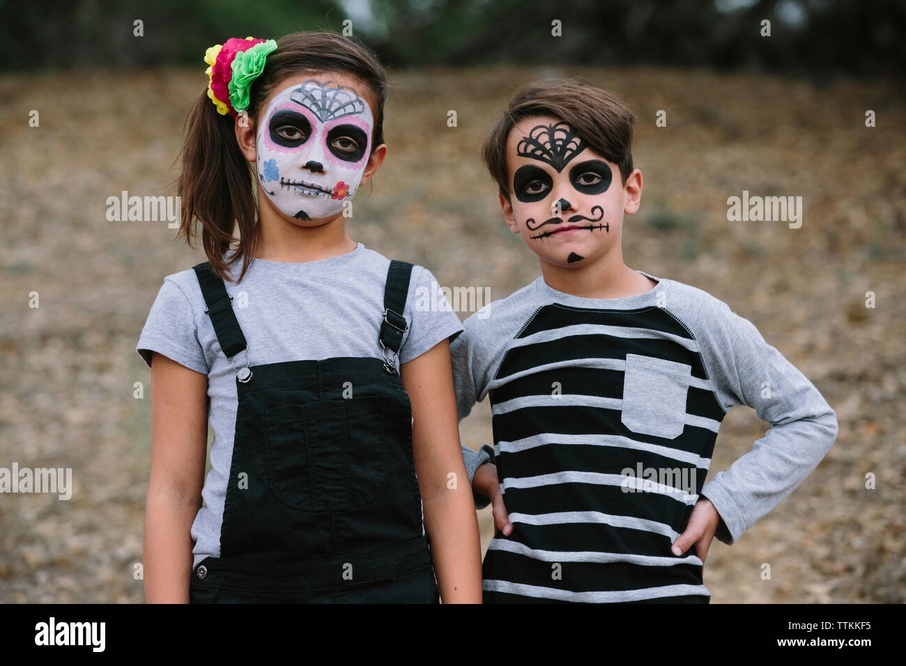 Portrait of siblings with face paint during Halloween Stock Photo