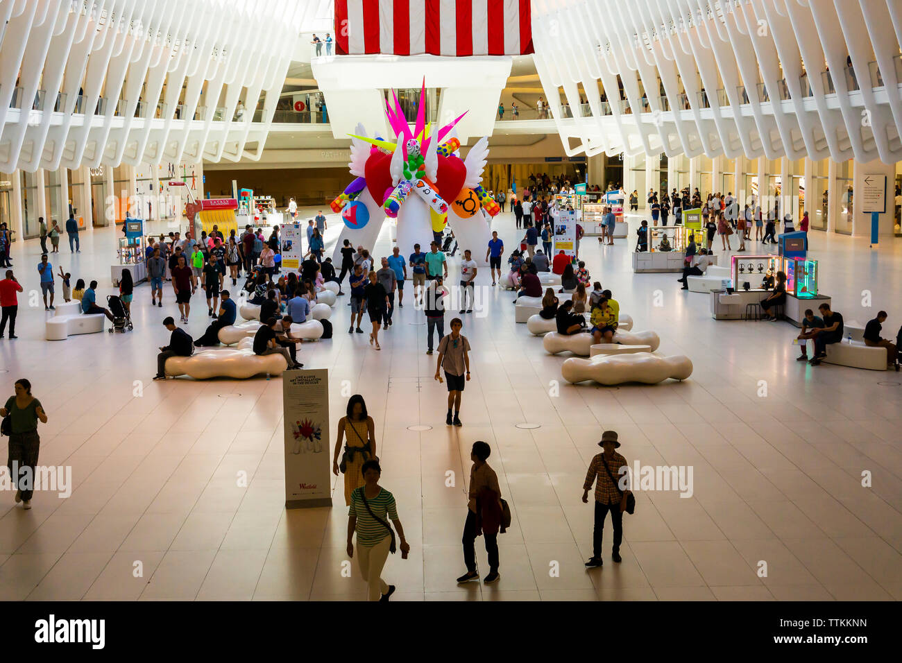 In celebration of Stonewall 50 visitors interact with the inflatable “Live 4 Love” sculpture in the Oculus of the World Trade Center Transportation Hub in New York on Saturday, Jun 15, 2019. The 20 foot-tall sculpture is decorated with design symbols representing issues important to the LGBTQ community and will be displayed in the Gay Pride Stonewall 50 Parade later in the month. (© Richard B. Levine) Stock Photo