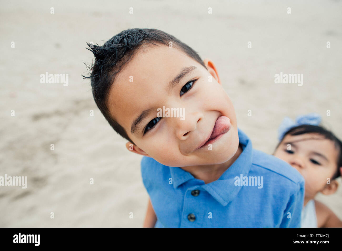 Little Boy Sticks Tongue Out For A Silly Portrait Stock Photo