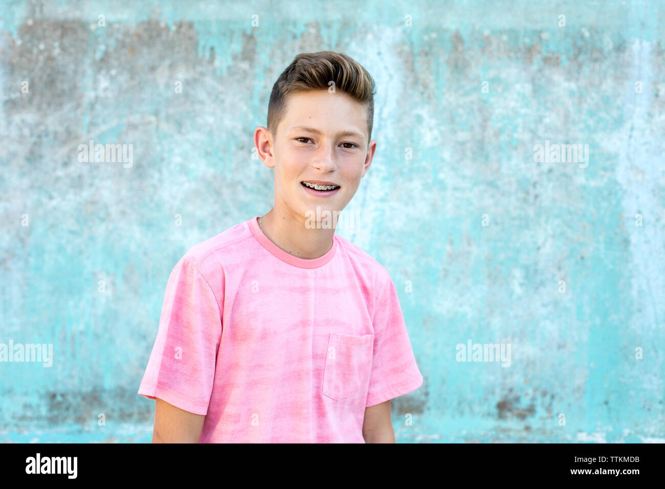 Smiling portrait of a handsome teen boy with braces Stock Photo