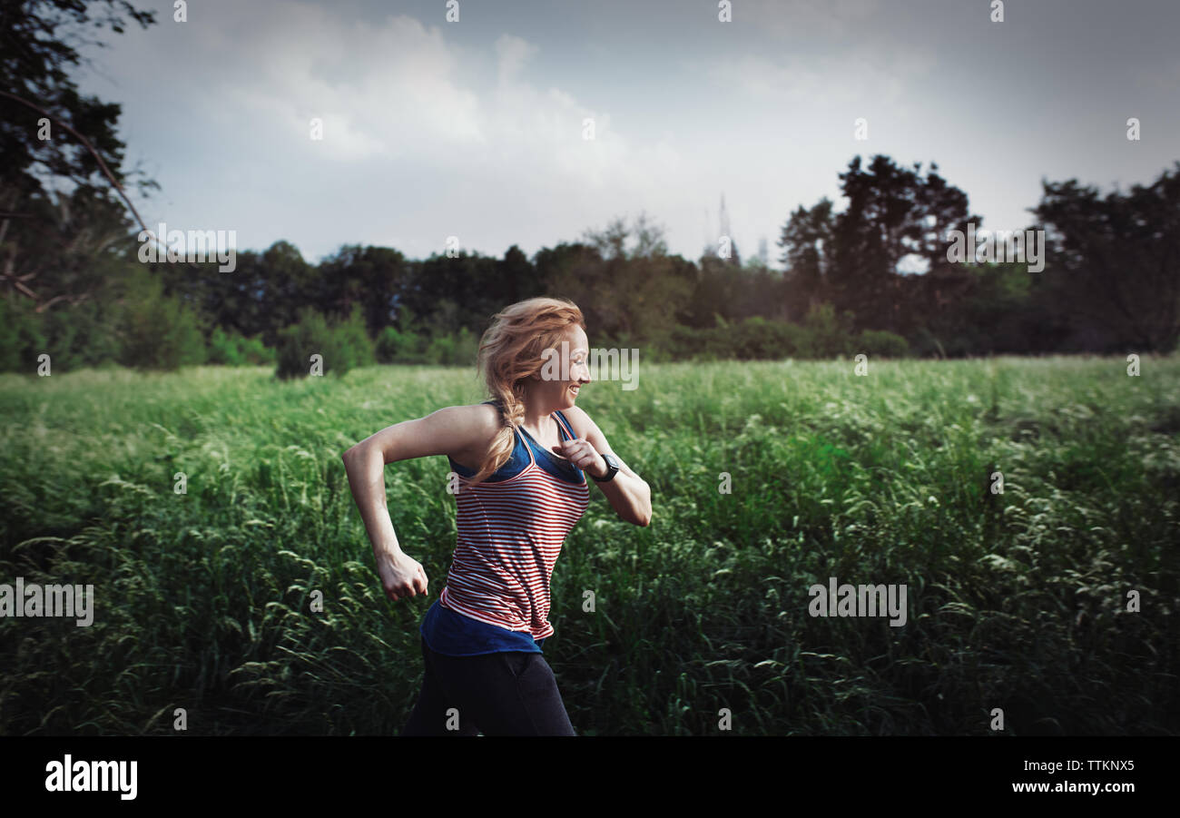 Woman running in public park hi-res stock photography and images - Alamy
