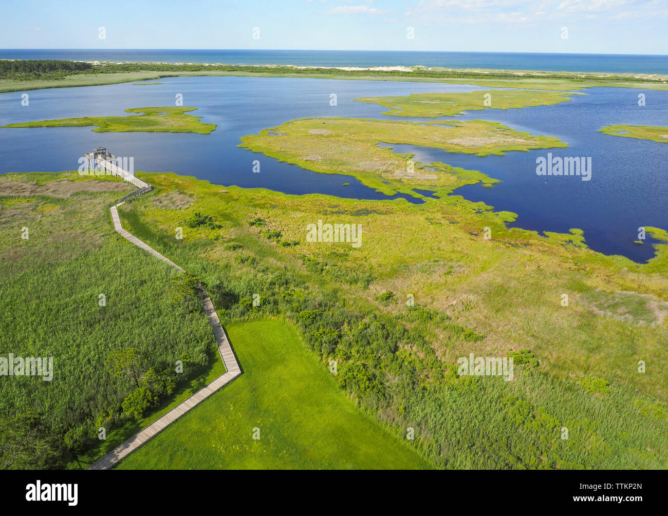 Aerial view of green landscape by river Stock Photo - Alamy