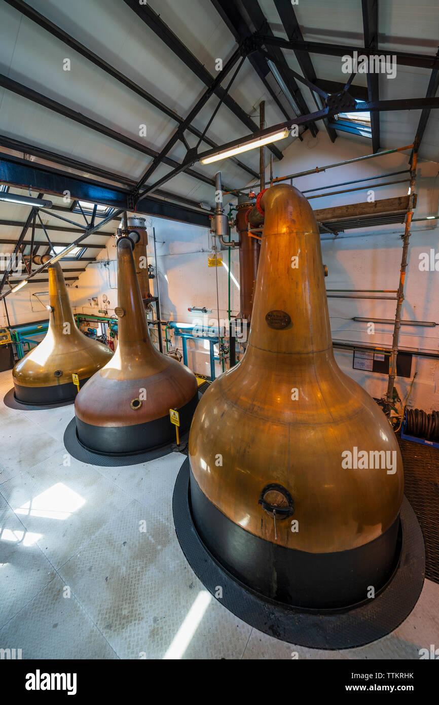 Stills inside still room Room at Bowmore Distillery on island of Islay in Inner Hebrides of Scotland, UK Stock Photo