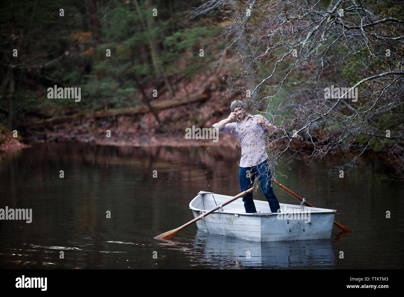 Man standing on water oars hi-res stock photography and images - Alamy